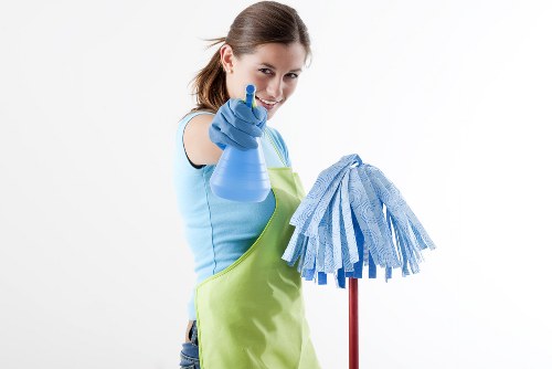 Cleaner restoring a vinyl or LVT floor in a North London home