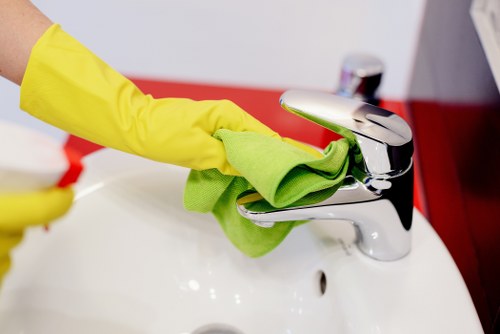 Carpet cleaning technician preparing safe equipment in a home