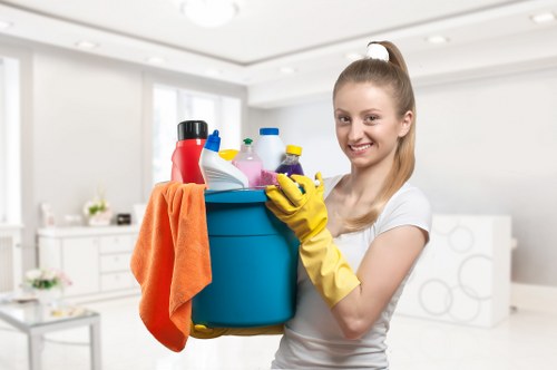 Cleaner treating stained carpet in a North London flat