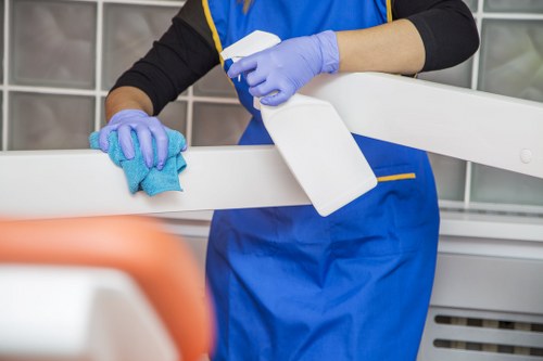 Professional home cleaning tasks in a North London kitchen and living area